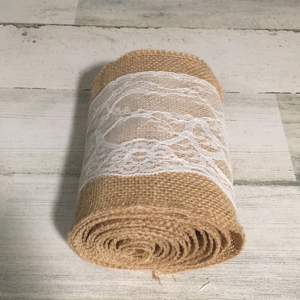 Tan burlap with approximately 98” of 5 1/2” wide white lace